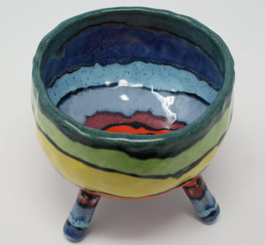 Delightful colourful pinched four legged bowl