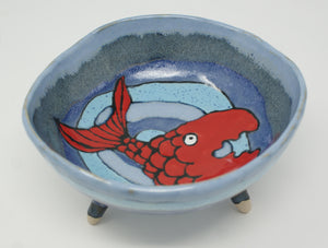 Round three legged bowl with red fish