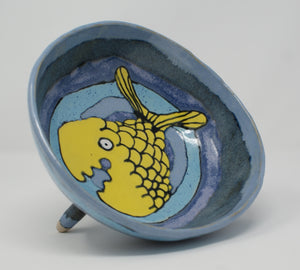 Round three legged bowl with yellow fish