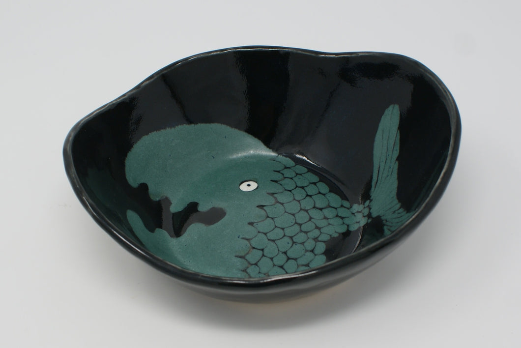 Black bowl with green fish