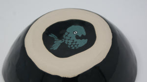 Black bowl with green fish