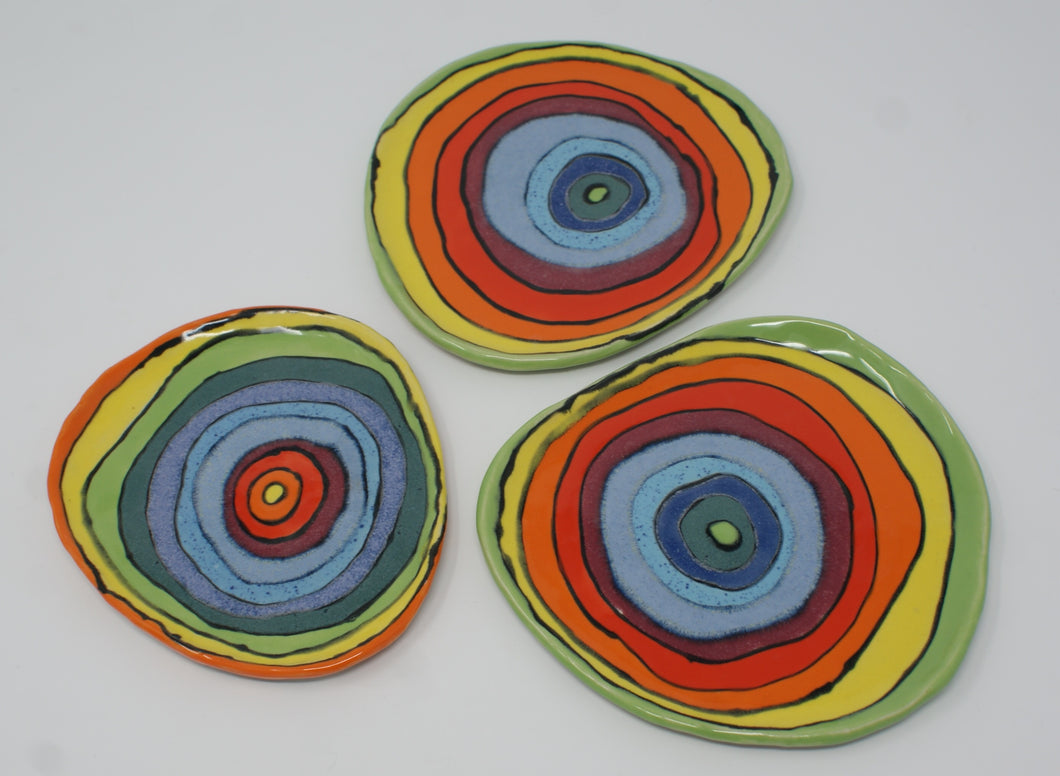 Set of three small colorful plates