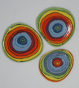 Set of three small colorful plates