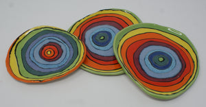 Set of three small colorful plates