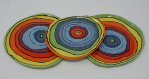 Set of three small colorful plates